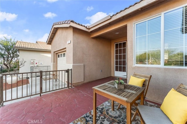 65565 Acoma Ave Unit 1, Desert Hot Springs, CA 92240 - view of patio with an attached garage