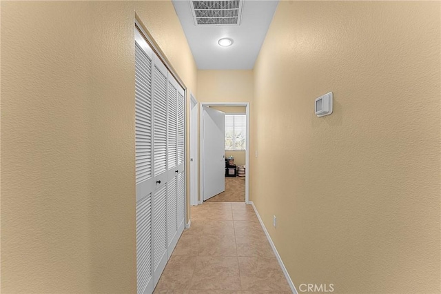 65565 Acoma Ave Unit 1, Desert Hot Springs, CA 92240 - hall with a textured wall and light tile patterned floors