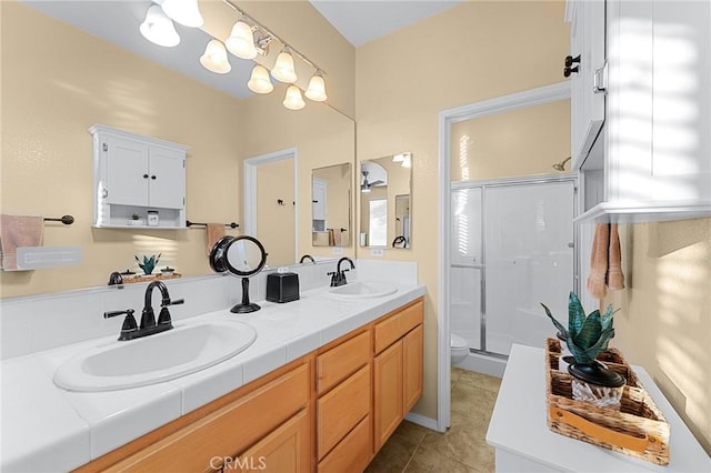 65565 Acoma Ave Unit 1, Desert Hot Springs, CA 92240 - bathroom with double vanity, a shower stall, tile patterned flooring, and a chandelier
