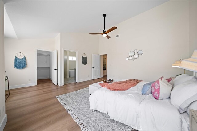 4431 W 138th St Unit B, Hawthorne, CA 90250 - bedroom with baseboards, wood finished floors, high vaulted ceiling, a walk in closet, and a ceiling fan