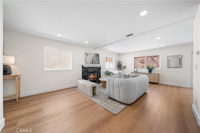 4431 W 138th St Unit B, Hawthorne, CA 90250 - living area with light wood-style flooring, plenty of natural light, a premium fireplace, baseboards, and recessed lighting