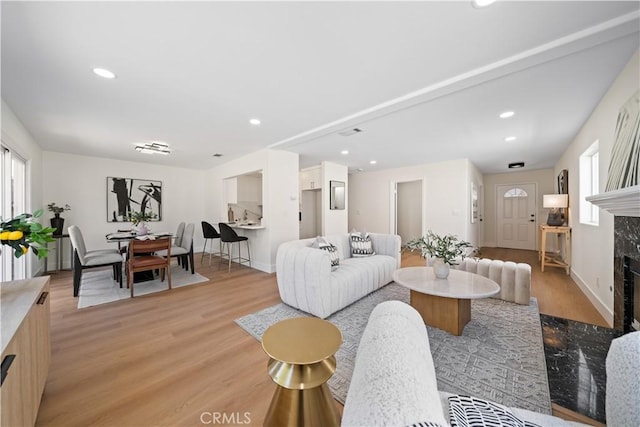 4431 W 138th St Unit B, Hawthorne, CA 90250 - living room featuring light wood-style floors, a fireplace, recessed lighting, and baseboards