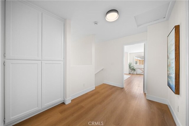 4431 W 138th St Unit B, Hawthorne, CA 90250 - hall featuring attic access, light wood finished floors, an upstairs landing, and baseboards