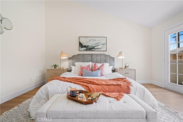 4431 W 138th St Unit B, Hawthorne, CA 90250 - bedroom with wood finished floors, baseboards, and access to exterior