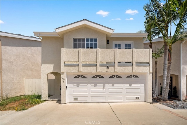 4431 W 138th St Unit B, Hawthorne, CA 90250 - view of front of property featuring a balcony, stucco siding, and driveway