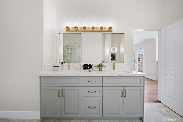 4431 W 138th St Unit B, Hawthorne, CA 90250 - bathroom with double vanity, an enclosed shower, and baseboards
