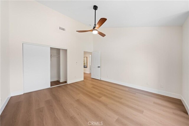 4431 W 138th St Unit B, Hawthorne, CA 90250 - unfurnished bedroom featuring light wood-style floors, a closet, baseboards, a ceiling fan, and a towering ceiling