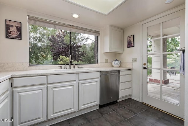 2025 Rosemont Ave Unit 2, Pasadena, CA 91103 - kitchen featuring stainless steel dishwasher, a sink, dark tile patterned flooring, white cabinetry, and light countertops
