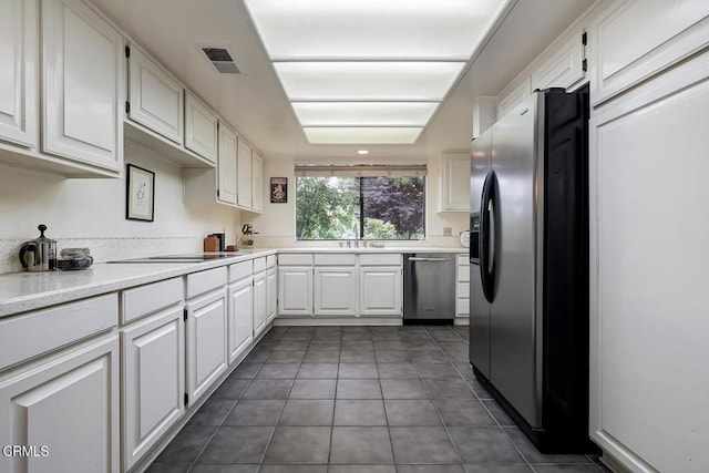2025 Rosemont Ave Unit 2, Pasadena, CA 91103 - kitchen with appliances with stainless steel finishes, white cabinets, tile patterned flooring, and light countertops