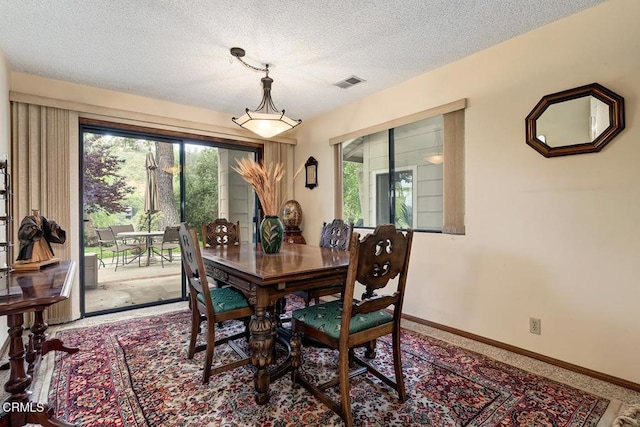 2025 Rosemont Ave Unit 2, Pasadena, CA 91103 - carpeted dining space featuring plenty of natural light, a textured ceiling, and baseboards