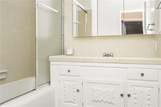 4660 Whitney Dr, El Monte, CA 91731 - full bathroom featuring vanity, tasteful backsplash, and bath / shower combo with glass door