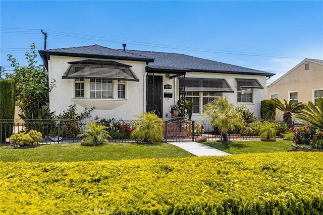 4660 Whitney Dr, El Monte, CA 91731 - view of front of house with stucco siding, a gate, and a shingled roof