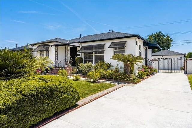 4660 Whitney Dr, El Monte, CA 91731 - bungalow-style house featuring a gate, stucco siding, and concrete driveway