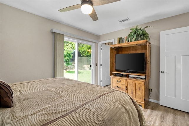 7052 Manhattan Dr, Riverside, CA 92506 - bedroom featuring access to exterior, light wood finished floors, and a ceiling fan