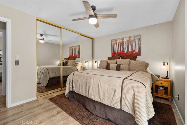 7052 Manhattan Dr, Riverside, CA 92506 - bedroom featuring wood finished floors, baseboards, a closet, and a ceiling fan
