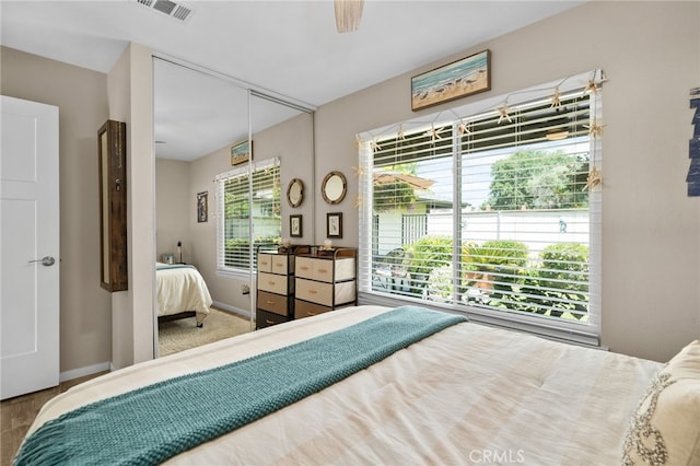 7052 Manhattan Dr, Riverside, CA 92506 - bedroom featuring a ceiling fan, baseboards, a closet, and wood finished floors
