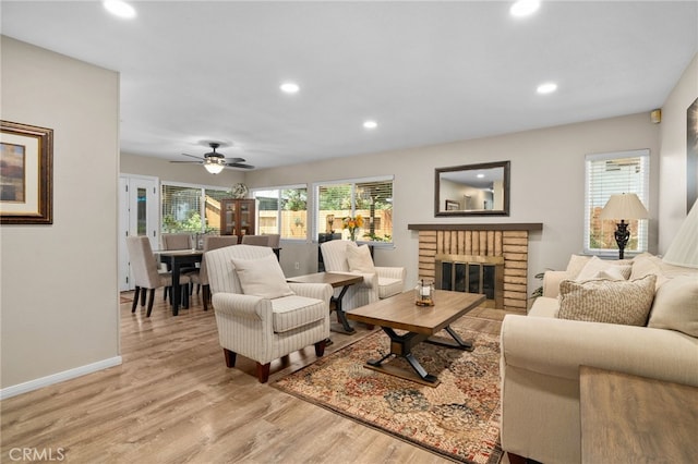 7052 Manhattan Dr, Riverside, CA 92506 - living area with recessed lighting, light wood-type flooring, a fireplace, a ceiling fan, and baseboards