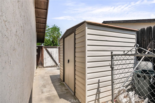 7052 Manhattan Dr, Riverside, CA 92506 - view of outbuilding with a gate
