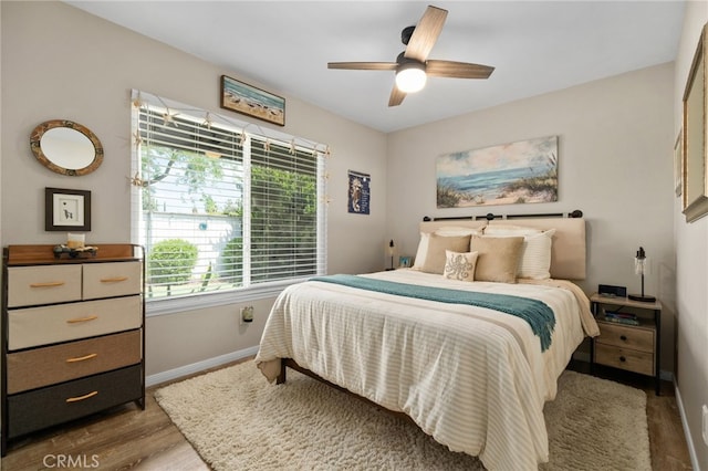 7052 Manhattan Dr, Riverside, CA 92506 - bedroom with baseboards, wood finished floors, and ceiling fan