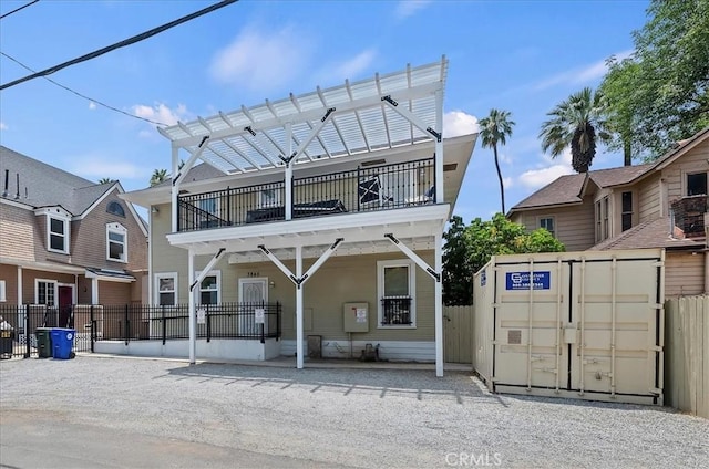 3845 10th St, Riverside, CA 92501 - back of house featuring a pergola and a balcony