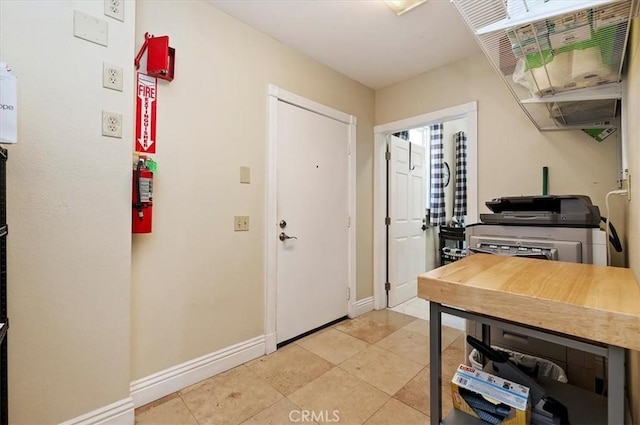 3845 10th St, Riverside, CA 92501 - entrance foyer with baseboards and light tile patterned floors