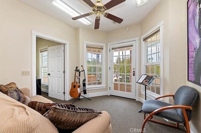 3845 10th St, Riverside, CA 92501 - carpeted living room with healthy amount of natural light, ceiling fan, and baseboards