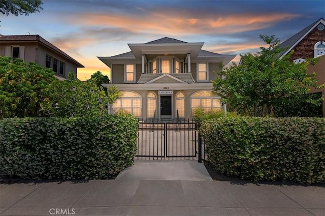 3845 10th St, Riverside, CA 92501 - view of front of home featuring a gate and a balcony