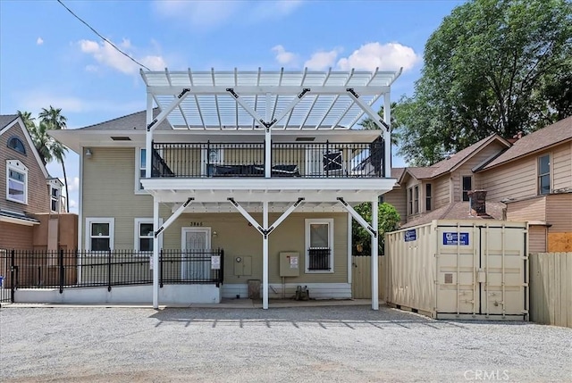 3845 10th St, Riverside, CA 92501 - view of front of home featuring a balcony and a pergola
