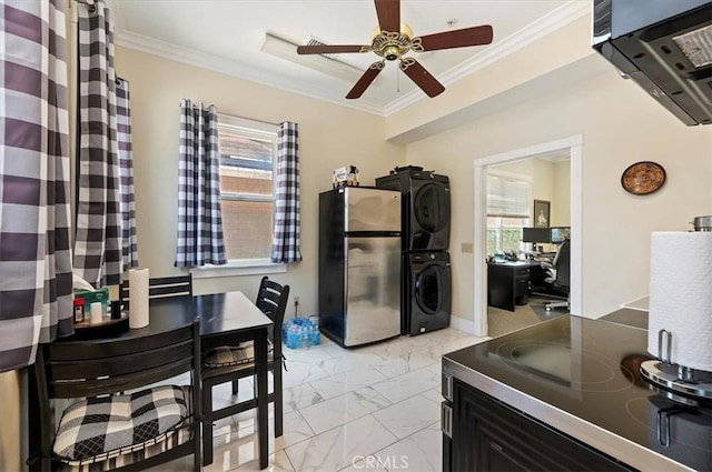 3845 10th St, Riverside, CA 92501 - kitchen featuring freestanding refrigerator, stacked washer and clothes dryer, a ceiling fan, light marble finish floors, and crown molding