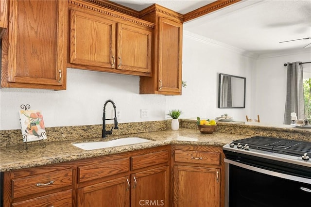 4514 Jamestown, Yorba Linda, CA 92886 - kitchen with a sink, stainless steel range with gas stovetop, brown cabinets, crown molding, and a ceiling fan