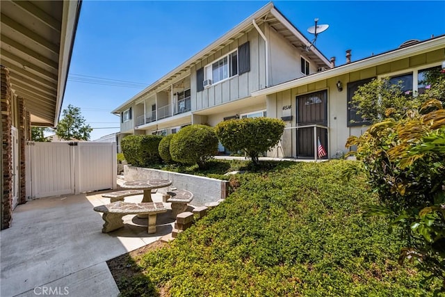 4514 Jamestown, Yorba Linda, CA 92886 - back of property with board and batten siding and a patio area