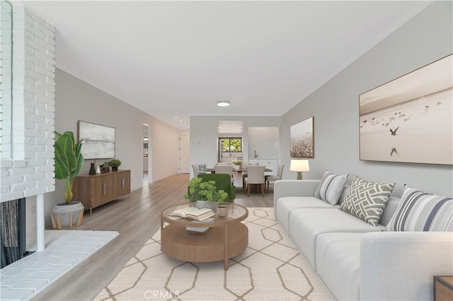 900 Cedar St Unit 308, El Segundo, CA 90245 - living area with light wood-style flooring, a fireplace, and recessed lighting