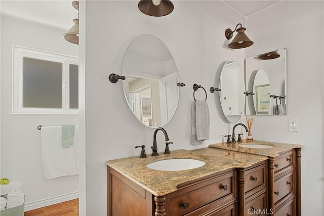 1330 S Center St, Redlands, CA 92373 - bathroom featuring double vanity and wood finished floors