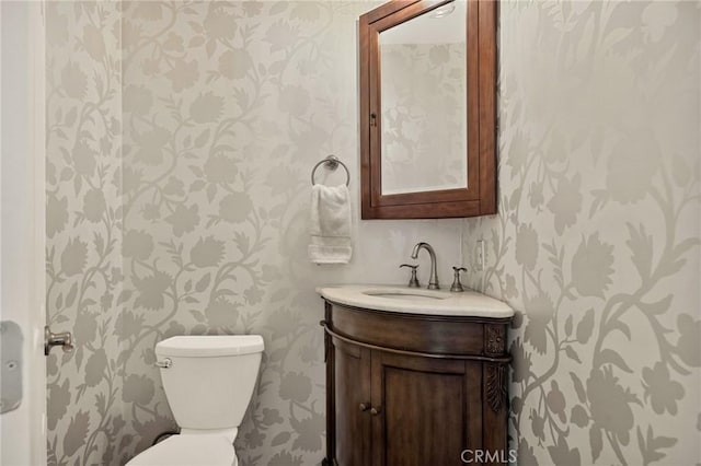 1330 S Center St, Redlands, CA 92373 - bathroom featuring wallpapered walls, vanity, and toilet
