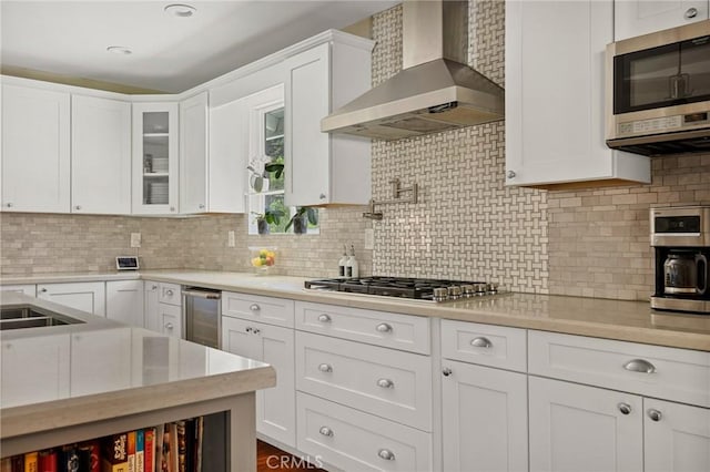 1330 S Center St, Redlands, CA 92373 - kitchen with wall chimney exhaust hood, appliances with stainless steel finishes, light countertops, and white cabinetry
