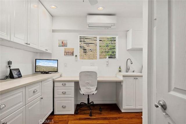 1330 S Center St, Redlands, CA 92373 - office area with a wall unit AC, built in study area, a sink, dark wood finished floors, and recessed lighting