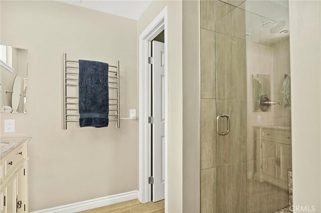 1330 S Center St, Redlands, CA 92373 - full bath featuring radiator, a shower stall, a towel warmer, vanity, and baseboards