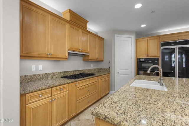 1315 Donegal Way, Oxnard, CA 93035 - kitchen with fridge, gas cooktop, recessed lighting, light stone countertops, and light tile patterned flooring