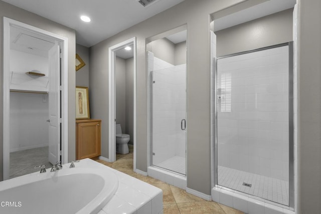 1315 Donegal Way, Oxnard, CA 93035 - full bathroom featuring a shower stall, a walk in closet, recessed lighting, tile patterned flooring, and tiled bath