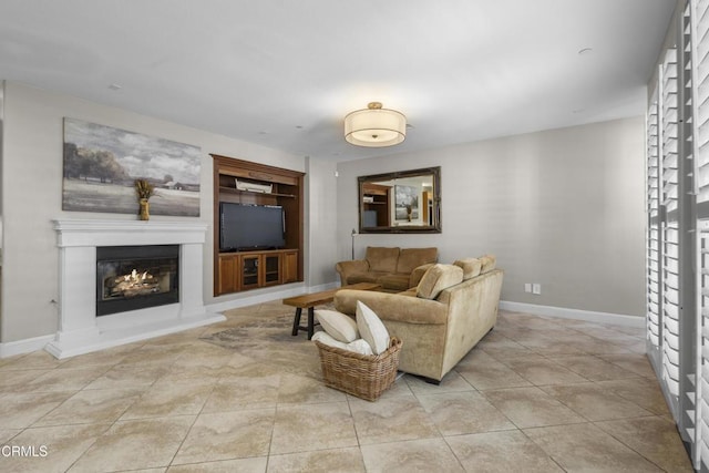 1315 Donegal Way, Oxnard, CA 93035 - living room featuring built in shelves, a glass covered fireplace, and light tile patterned floors
