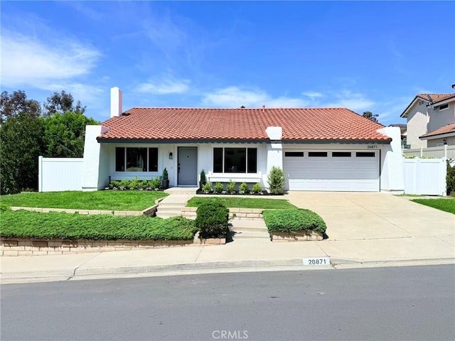26871 Recodo Ln, Mission Viejo, CA 92691 - view of front facade featuring a garage, a tiled roof, stucco siding, and driveway