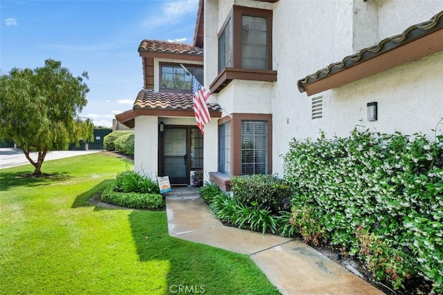 1132 Santiago Dr Unit 11, Placentia, CA 92870 - property entrance with stucco siding, a yard, and a tiled roof