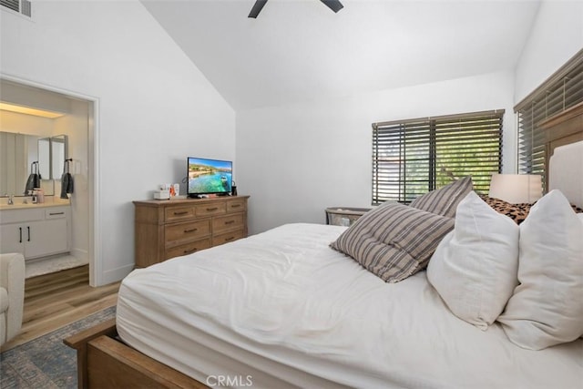 1132 Santiago Dr Unit 11, Placentia, CA 92870 - bedroom with vaulted ceiling, wood finished floors, ensuite bath, and ceiling fan