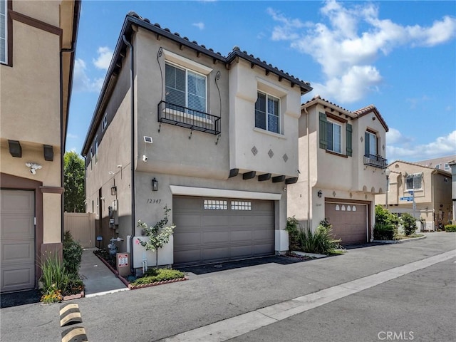12347 N Aragon Way, Sylmar, CA 91342 - view of front of home with stucco siding, an attached garage, and a tiled roof