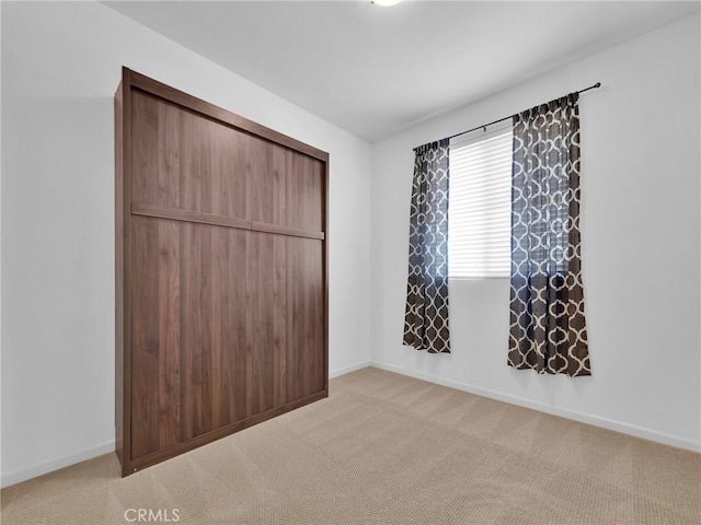 12347 N Aragon Way, Sylmar, CA 91342 - unfurnished bedroom with light colored carpet, baseboards, and a closet