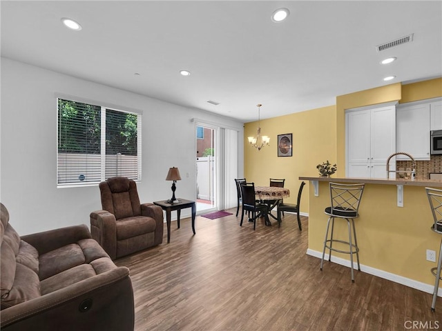 12347 N Aragon Way, Sylmar, CA 91342 - living room featuring a chandelier, dark wood-type flooring, recessed lighting, and baseboards