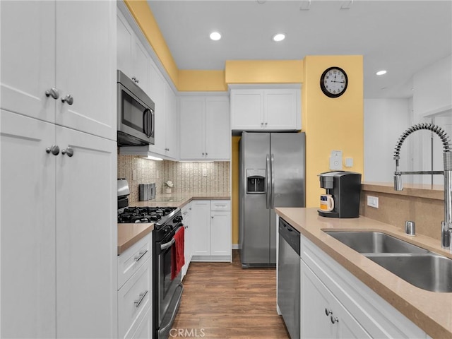12347 N Aragon Way, Sylmar, CA 91342 - kitchen featuring stainless steel appliances, a sink, backsplash, white cabinets, and recessed lighting