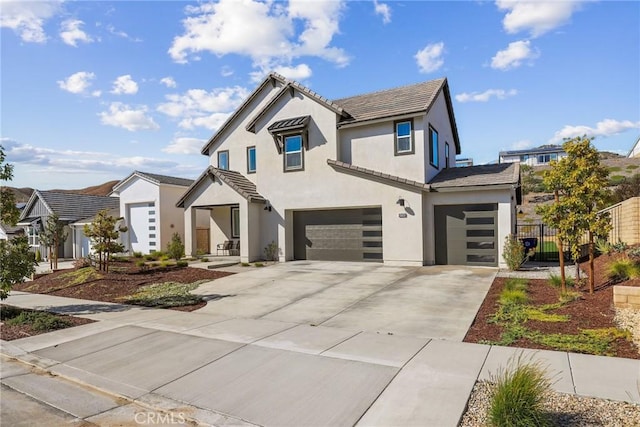 28709 Wildflower, Castaic, CA 91384 - view of front of home featuring a garage, stucco siding, driveway, and a tile roof