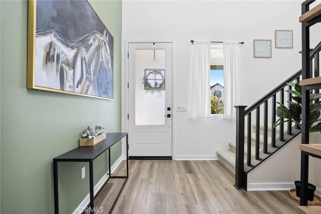 28709 Wildflower, Castaic, CA 91384 - entryway featuring wood finished floors, stairway, and baseboards