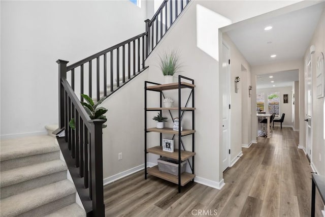 28709 Wildflower, Castaic, CA 91384 - staircase featuring recessed lighting, wood finished floors, and baseboards